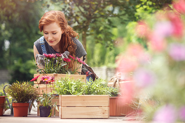 Woman potting plants.