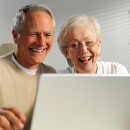 Happy Mature Couple On Laptop 400 600px