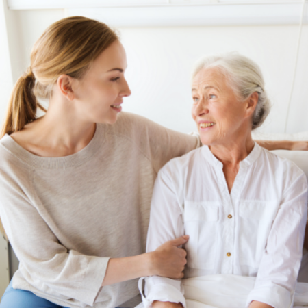 Woman being consoled by female family member or friend