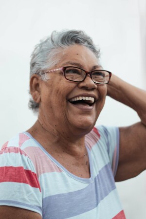 Woman laughing and looking relaxed.